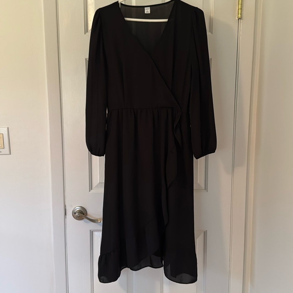 New without tags, never worn black dress looks like a wrap dress, but is not.